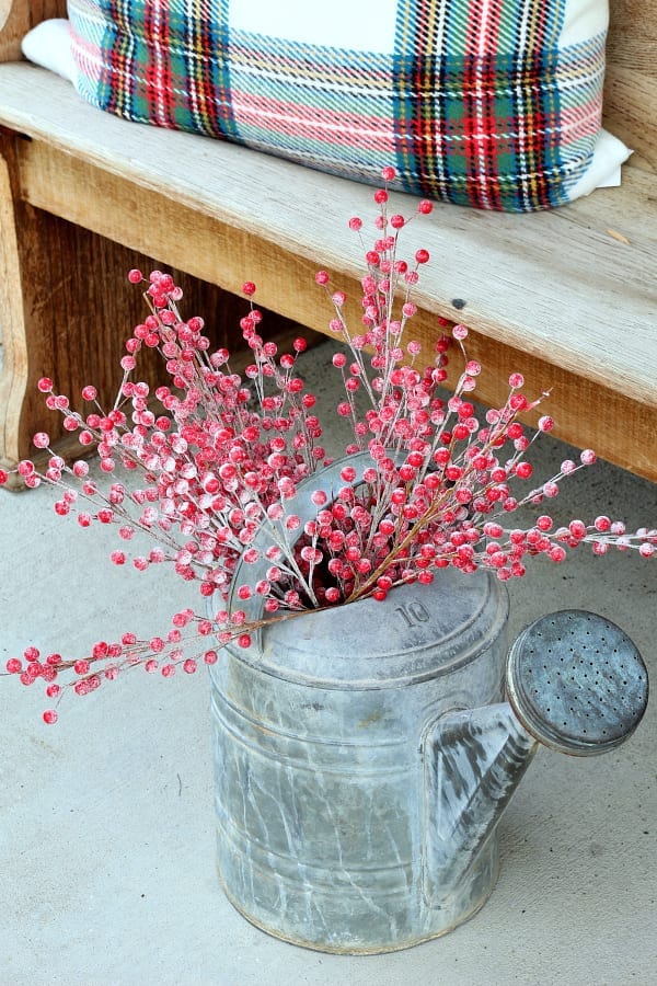 Christmas on the porch means flea market finds and red berries.