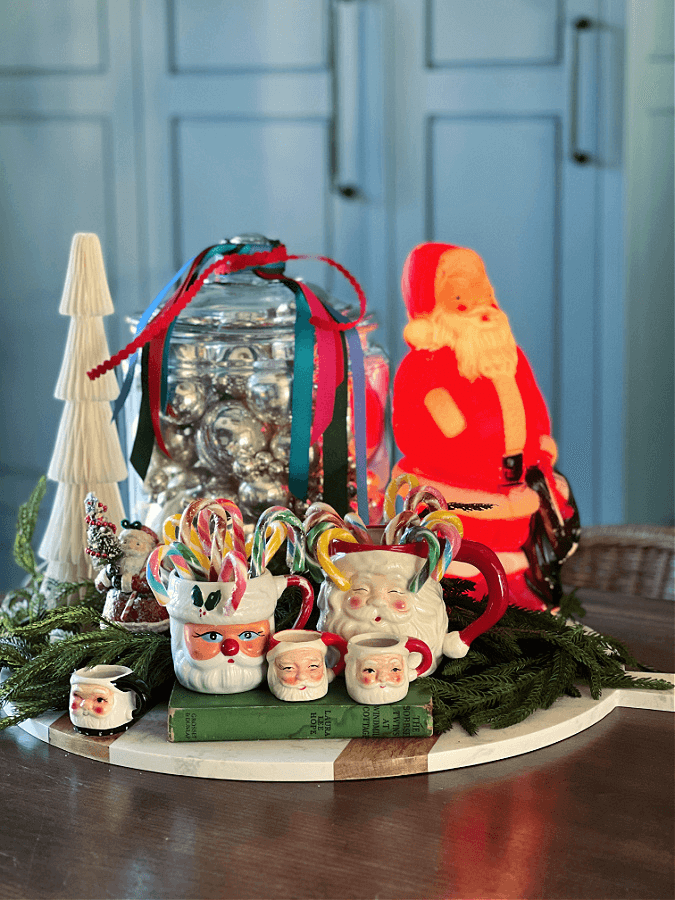 santa mugs, and santa blow mold on kitchen counter