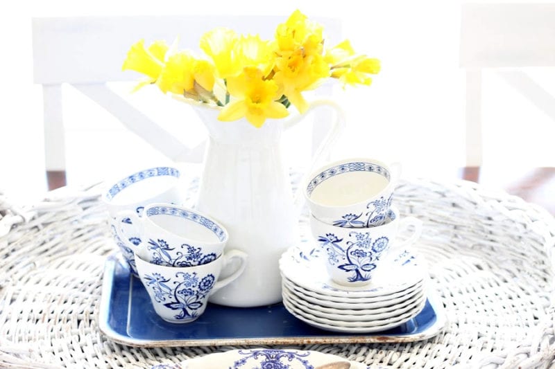 yellow daffodils and blue and white tea cups