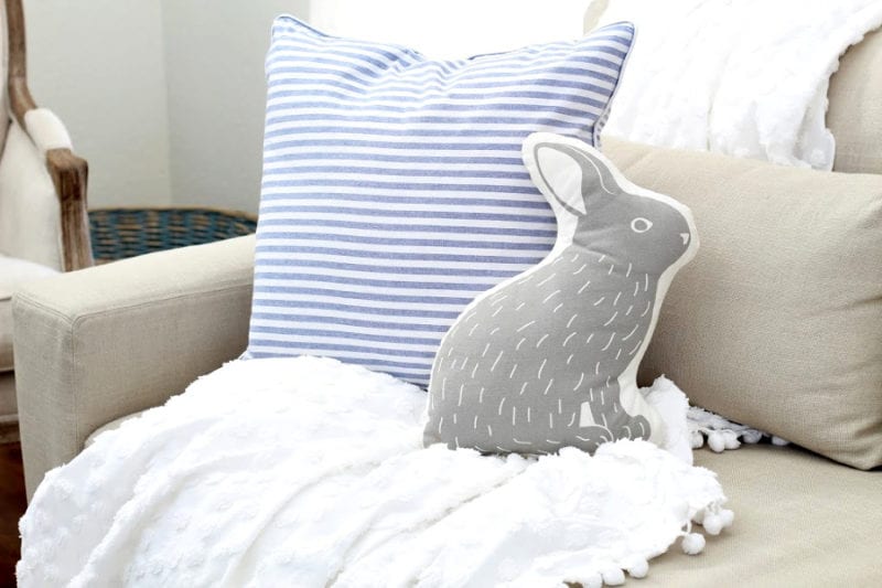 Rabbit pillow on sofa.