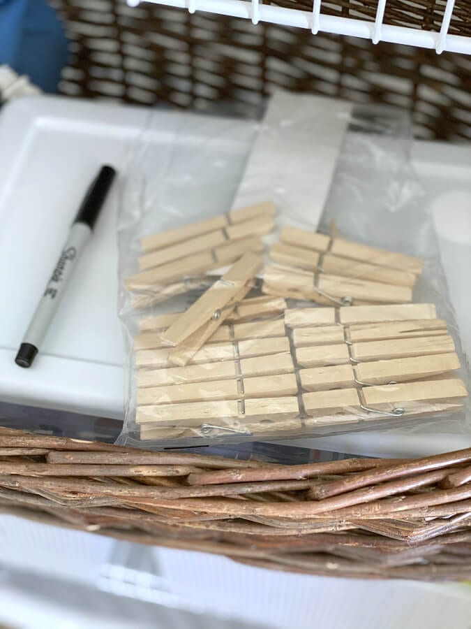 Clothespins and a sharpie are great tools for labeling linen closet storage bins.