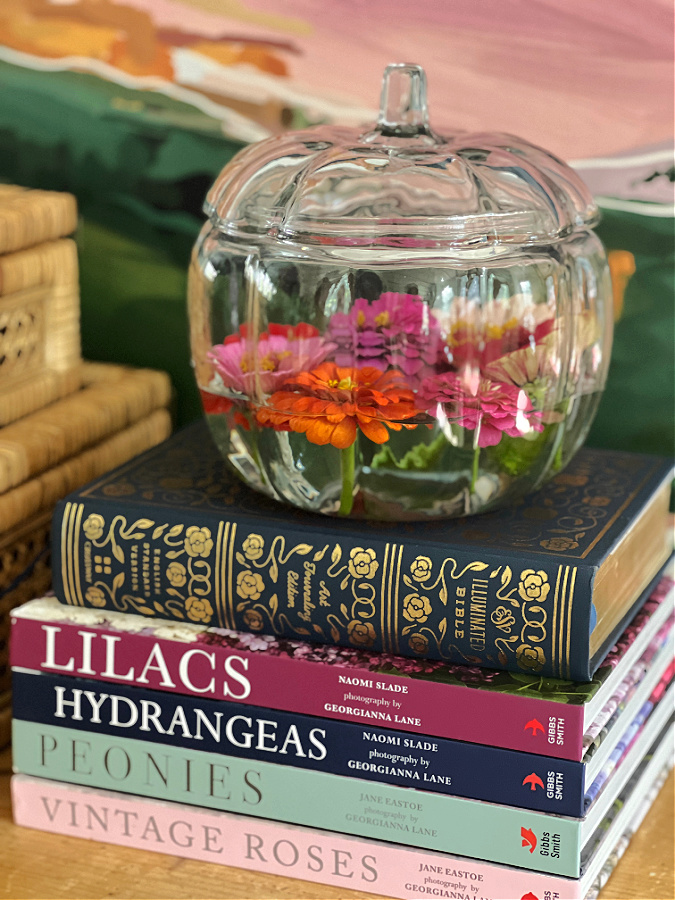 glass pumpkin, flowers, books